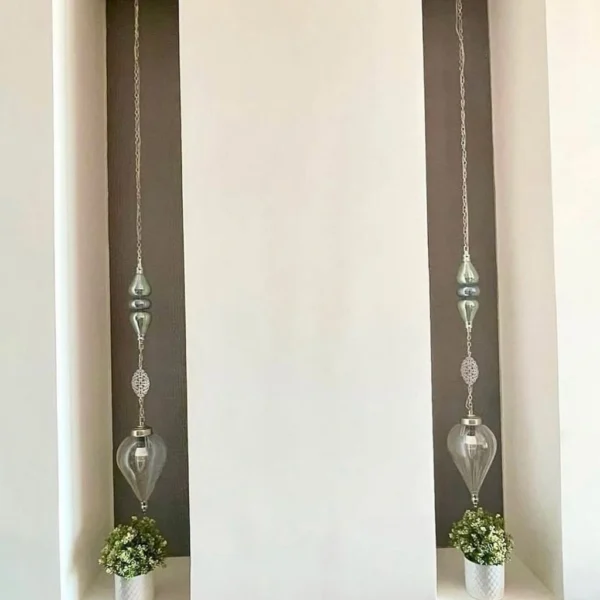 نجف نحاس مودرن بتصميم انسيابي مزين بالكريستال الفاخر من المشكاة